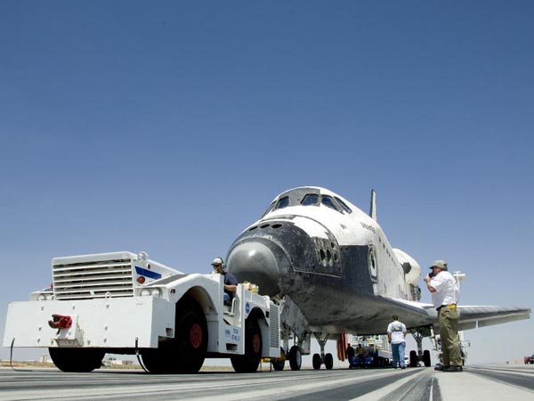 Ground crews begin towing Space Shuttle Atlantis from the main runway at Edwards Air Force Base following its landing May 24, 2009, which concluded the STS-125 mission to upgrade the Hubble Space Telescope.  (http://www.nasa.gov)