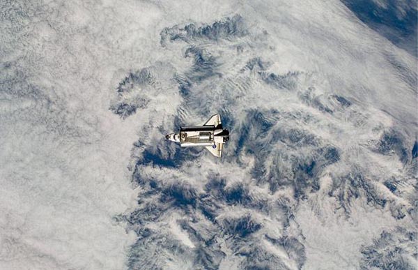 Space Shuttle Endeavour approaches the International Space Station with its cargo bay doors open and the Leonardo Multi-Purpose Logistics Module visible inside the shuttle's cargo bay. (http://www.telegraph.co.uk)